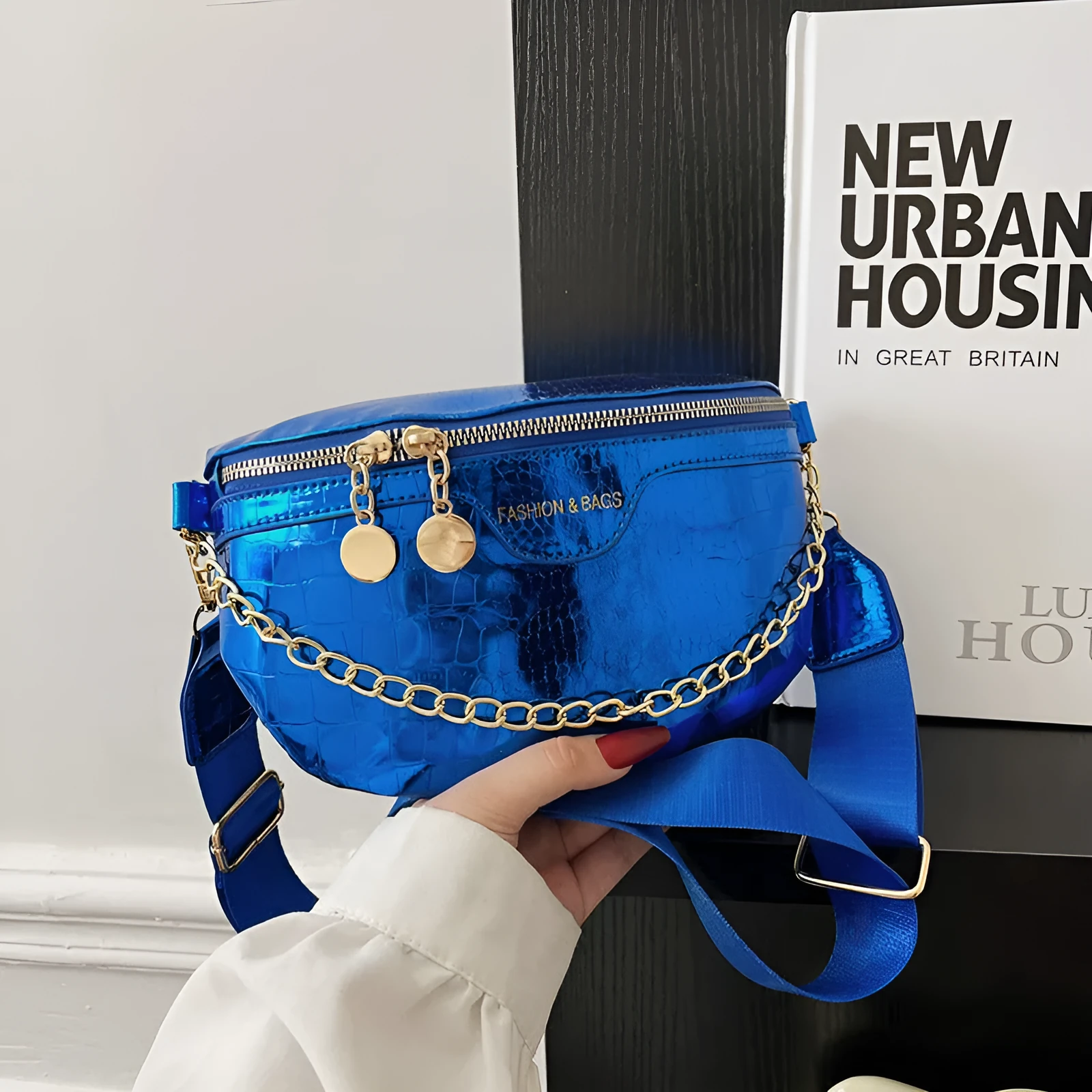 Shiny PU chest bag with chain shoulder strap available in silver colour