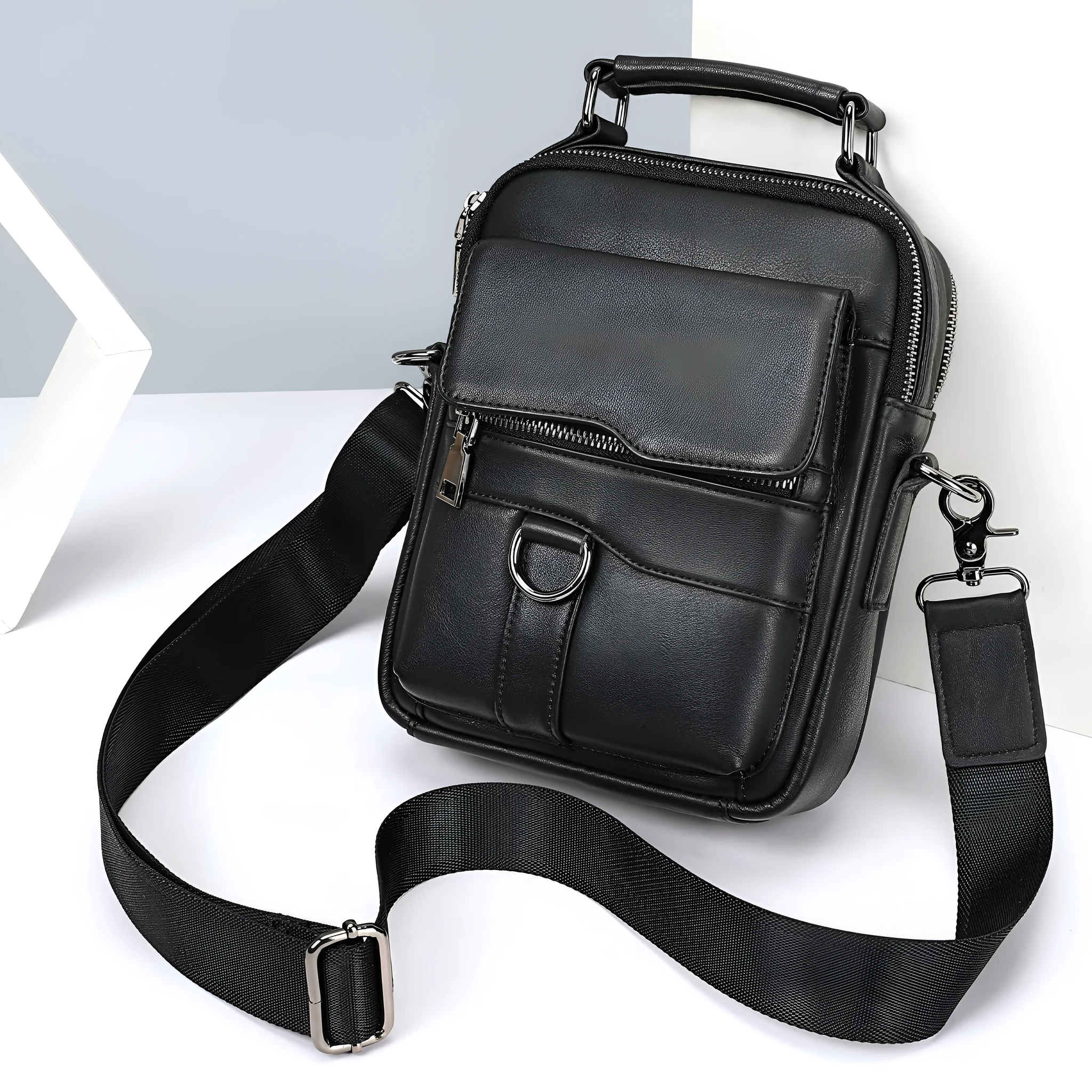Black genuine first layer cowhide leather messenger bag measuring 19x8x24cm with slung strap