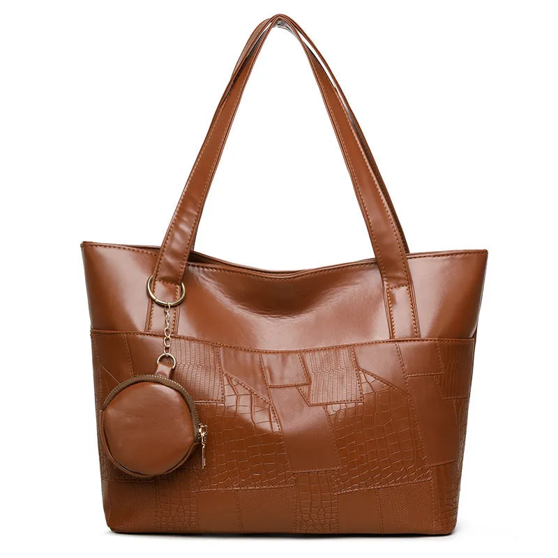 Large capacity soft PU tote bag for women in beige, brown, and black, with double shoulder straps and sewing thread detail.