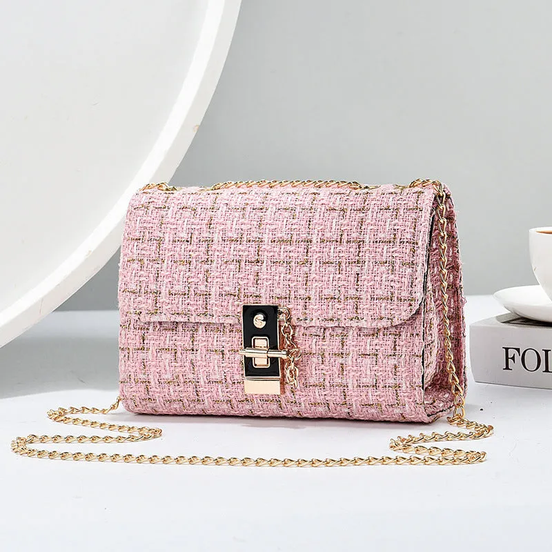 Woolen twist lock shoulder bag with gold silk contrast colour, clamshell design, and chain accent in beige