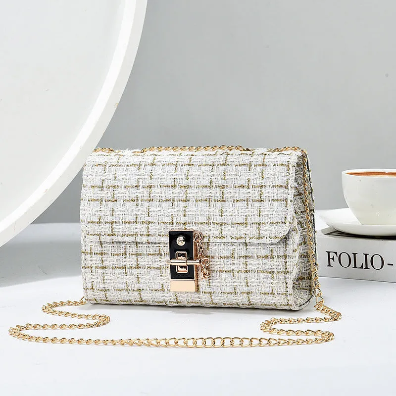 Woolen twist lock shoulder bag with gold silk contrast colour, clamshell design, and chain accent in beige