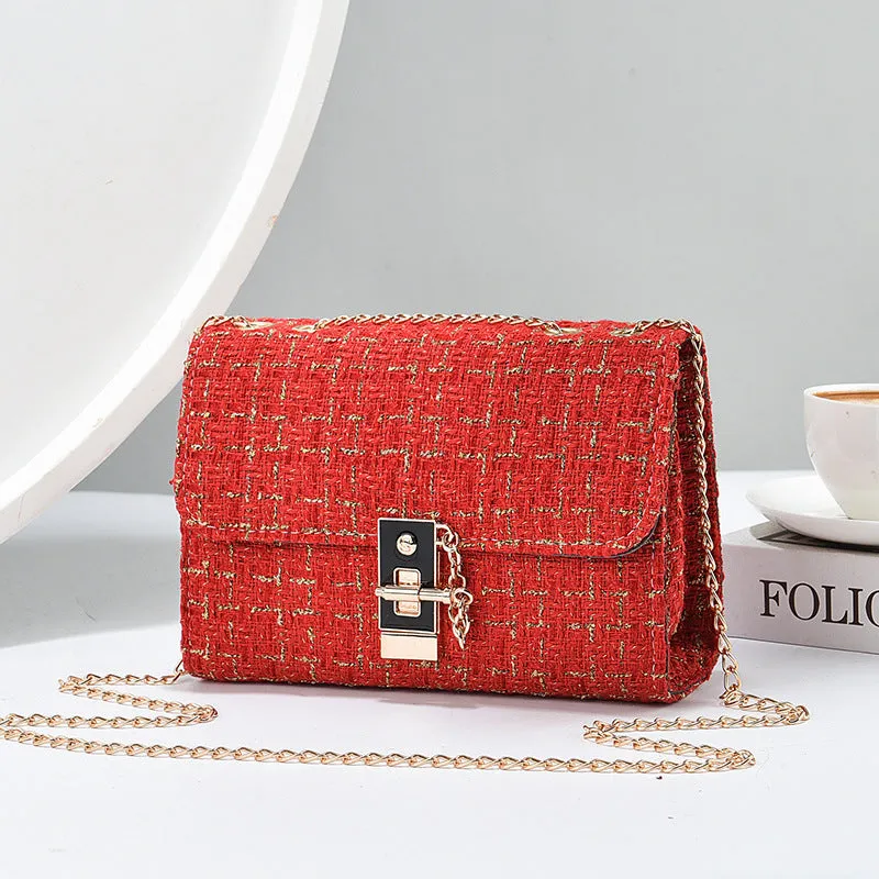 Woolen twist lock shoulder bag with gold silk contrast colour, clamshell design, and chain accent in beige
