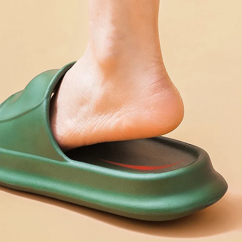 Pair of thick-soled EVA flip-flop slippers in a chosen colour on a bathroom floor.
