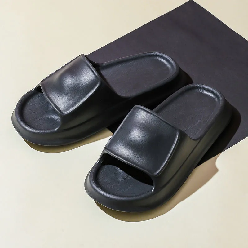 Pair of thick-soled EVA flip-flop slippers in a chosen colour on a bathroom floor.