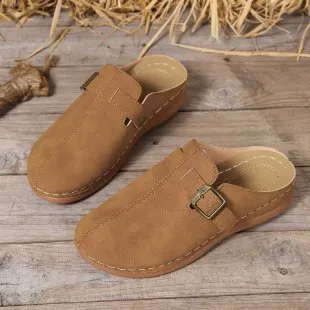 Women's lightweight wedge slipper in cloth with rubber sole, shown in one of five colours.