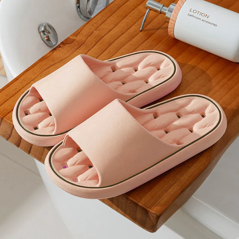 Non-slip EVA bathroom slippers with thick sole and hollow upper in grey, side view