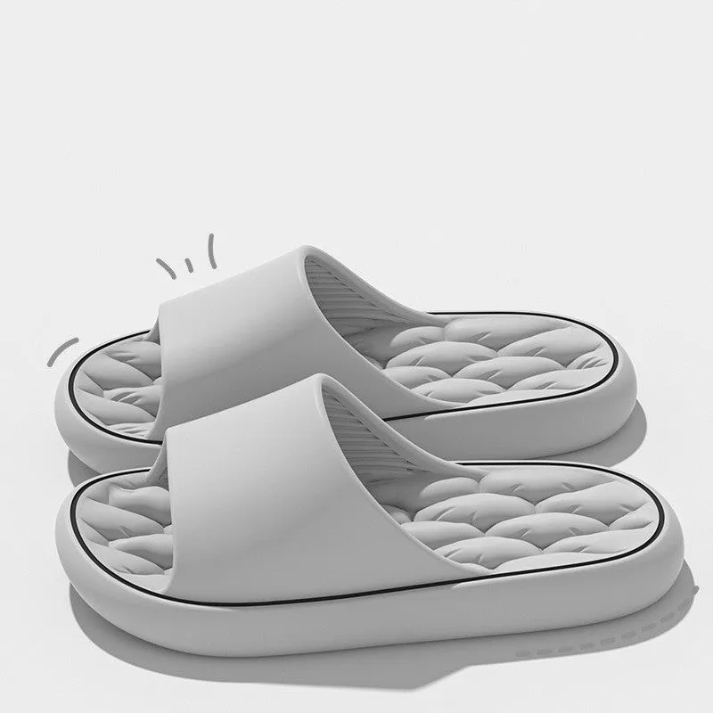 Non-slip EVA bathroom slippers with thick sole and hollow upper in grey, side view
