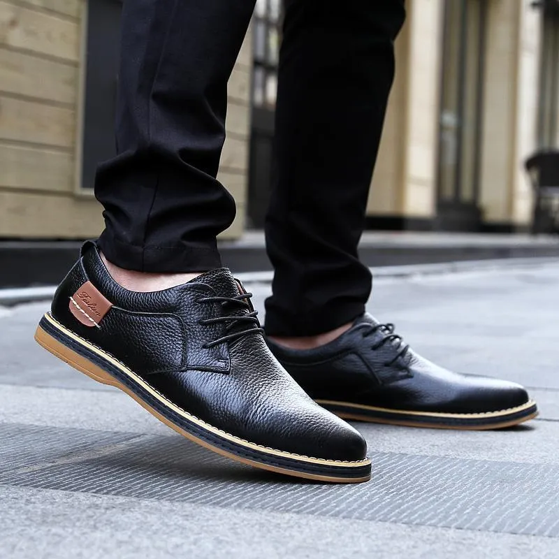 Large size 48 men's British style leather shoes in black with microfiber upper and rubber sole