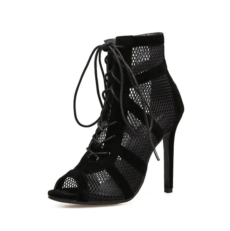 Black suede women's high heel shoes with 11.5cm stiletto heel and pointed toe on a light background
