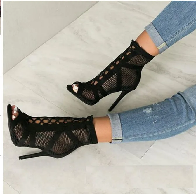 Black suede women's high heel shoes with 11.5cm stiletto heel and pointed toe on a light background