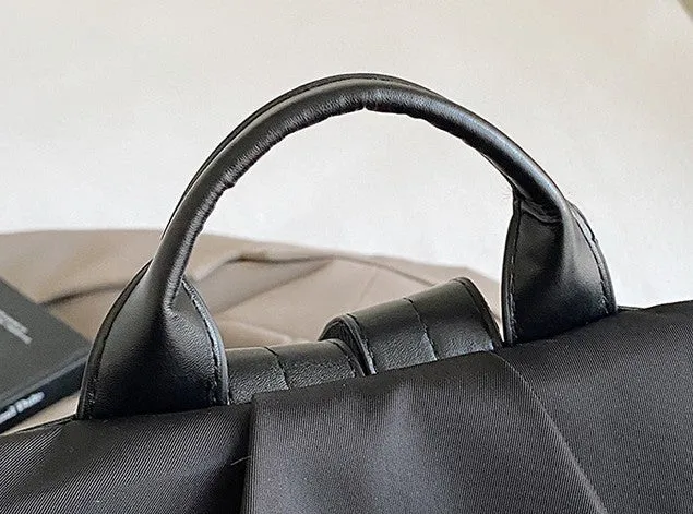 Women's black travel backpack with contrast stitching, large capacity, and three-dimensional outer pocket
