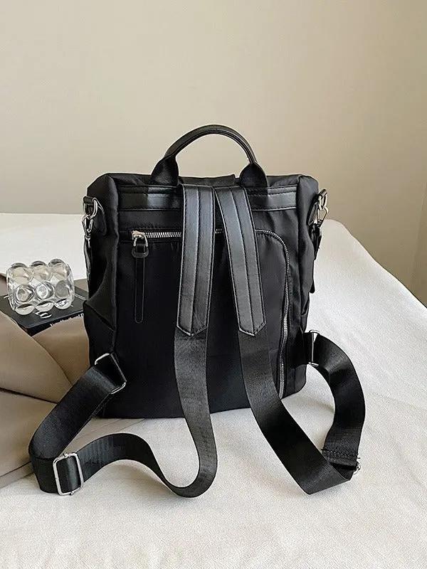 Women's black travel backpack with contrast stitching, large capacity, and three-dimensional outer pocket