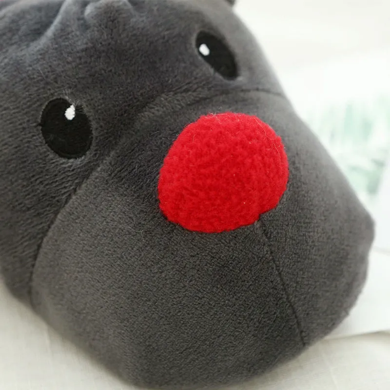 Grey super soft fleece home slippers with cute elk design, placed on a floor