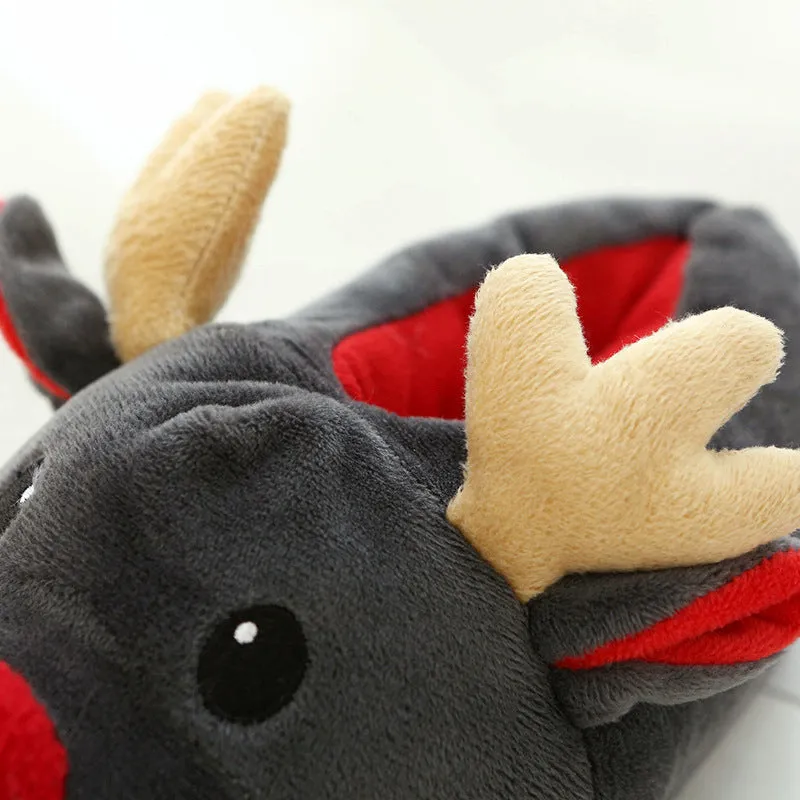 Grey super soft fleece home slippers with cute elk design, placed on a floor
