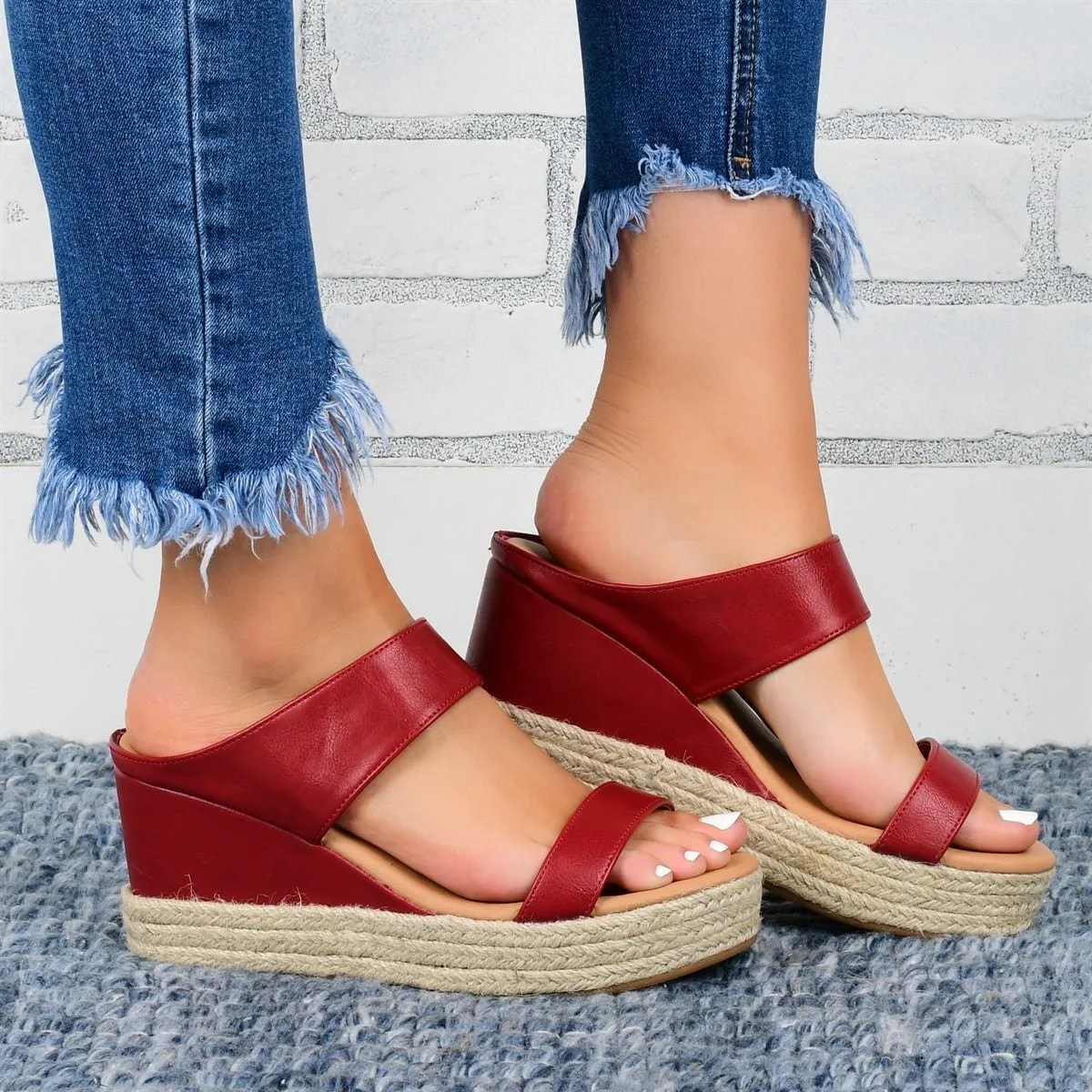 Women's wedge heel slippers in white with hollow design, round toe, and rubber sole