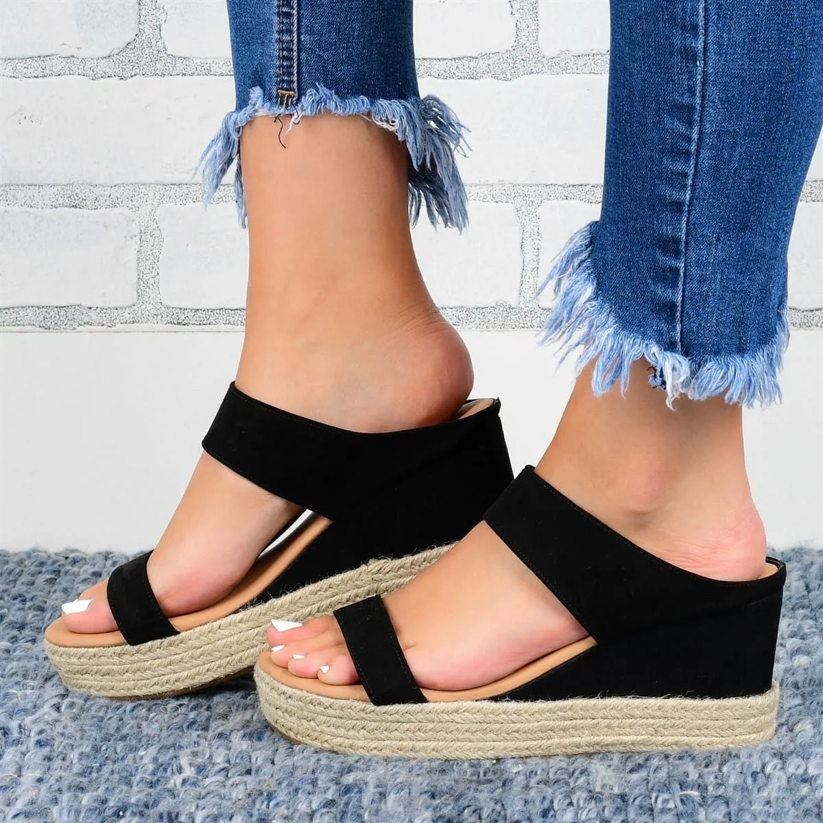Women's wedge heel slippers in white with hollow design, round toe, and rubber sole