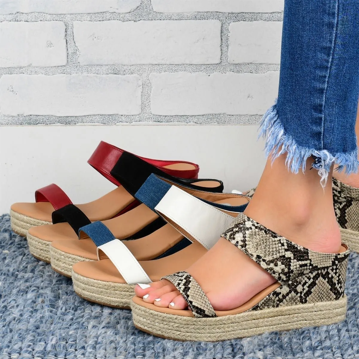 Women's wedge heel slippers in white with hollow design, round toe, and rubber sole