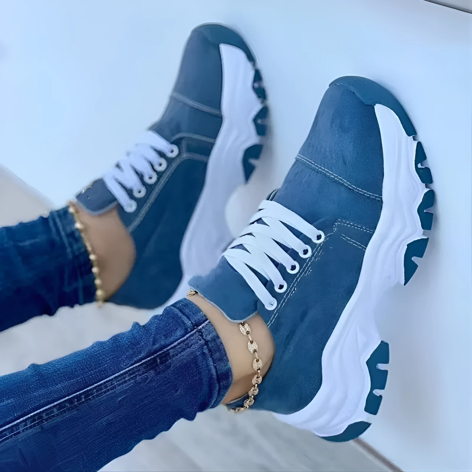 Women's platform lace-up sneaker with rubber sole, round toe, and thick platform in solid red colour