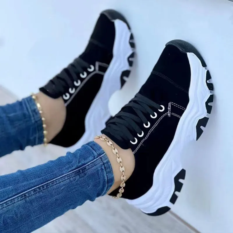 Women's platform lace-up sneaker with rubber sole, round toe, and thick platform in solid red colour