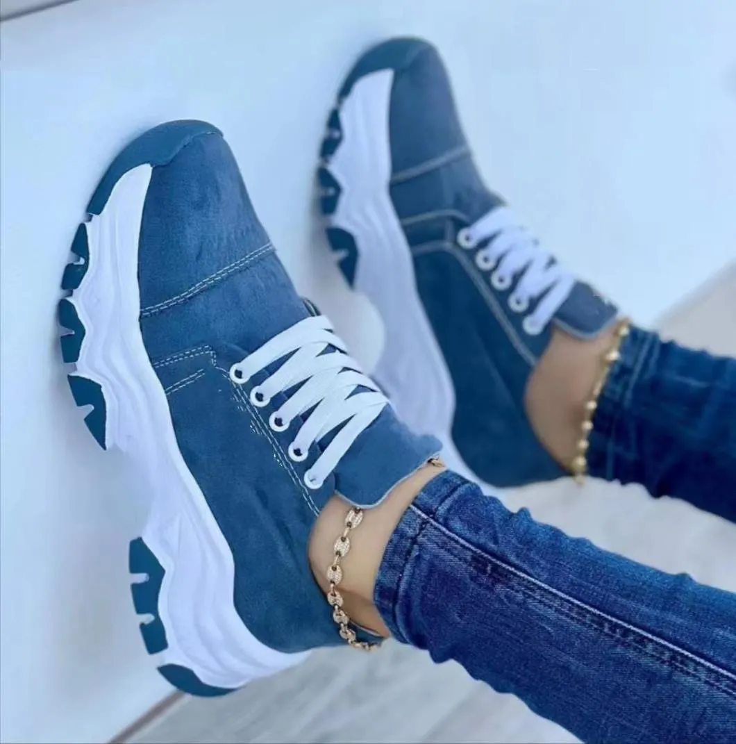 Women's platform lace-up sneaker with rubber sole, round toe, and thick platform in solid red colour
