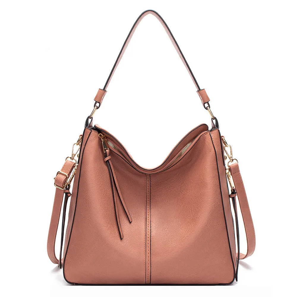 Large capacity PU hobo bag for women with zip closure, internal pockets, and soft handles in solid colour