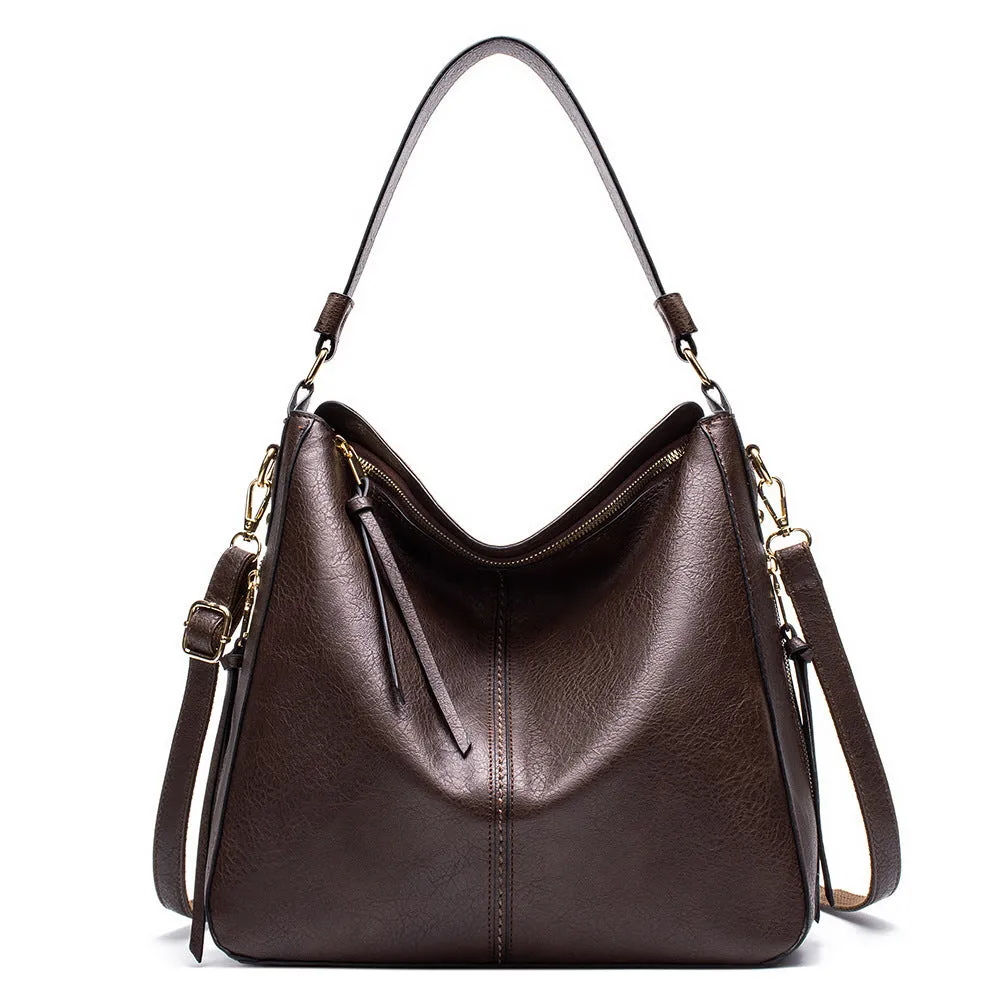 Large capacity PU hobo bag for women with zip closure, internal pockets, and soft handles in solid colour