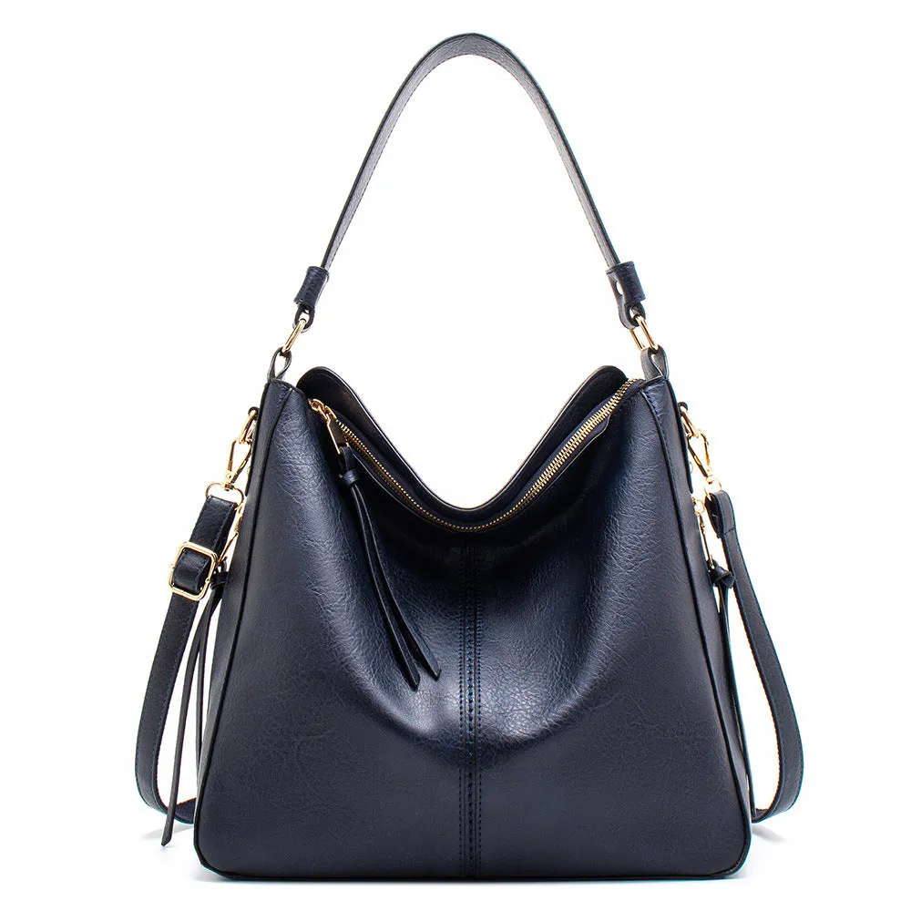 Large capacity PU hobo bag for women with zip closure, internal pockets, and soft handles in solid colour