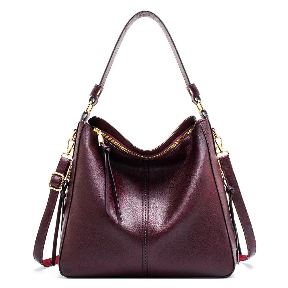 Large capacity PU hobo bag for women with zip closure, internal pockets, and soft handles in solid colour