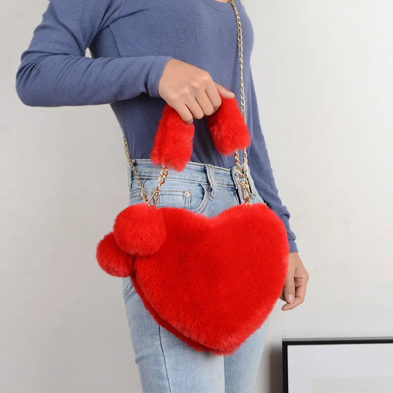 Love Bags soft plush heart-shaped handbag with zipper closure and removable handle in solid colour
