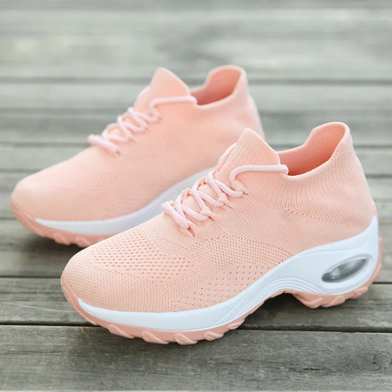 Women's flying knit platform sneakers in black with round toe and waterproof sole