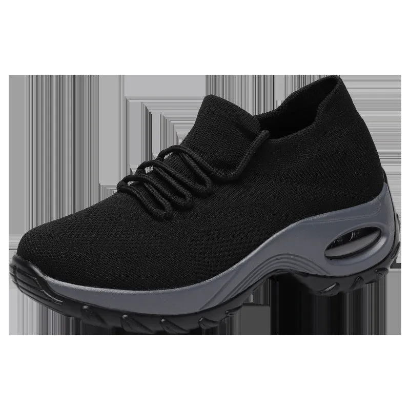 Women's flying knit platform sneakers in black with round toe and waterproof sole