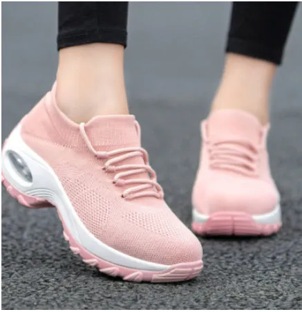 Women's flying knit platform sneakers in black with round toe and waterproof sole