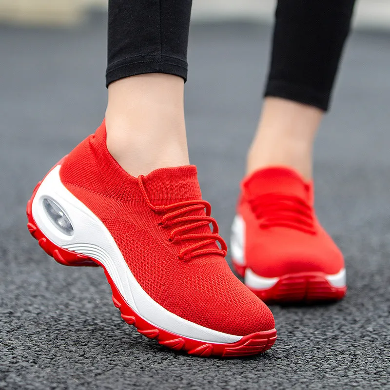 Women's flying knit platform sneakers in black with round toe and waterproof sole