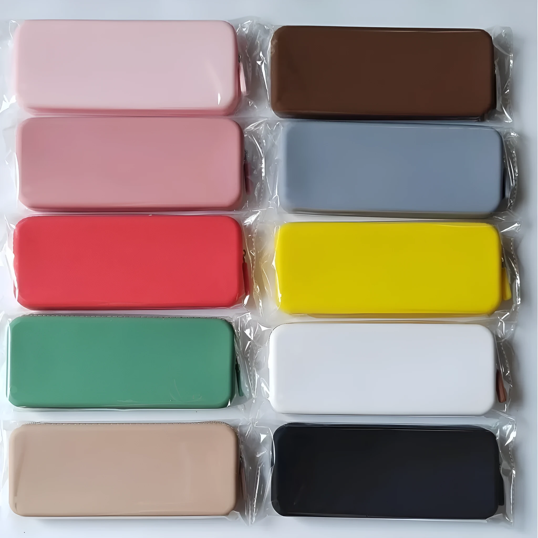 Slim silicone makeup brush storage bag in assorted colours, shown with brushes inside.