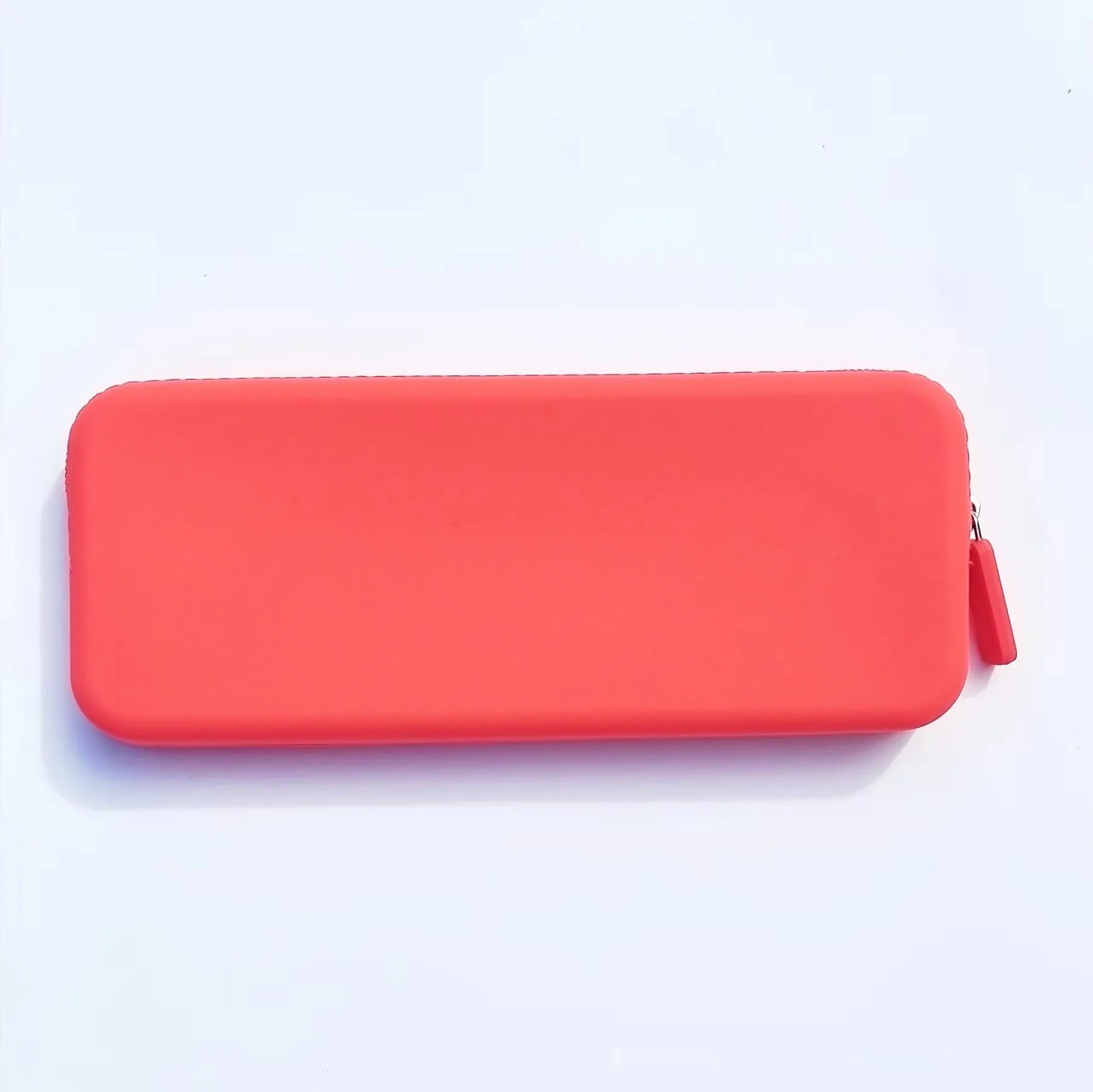 Slim silicone makeup brush storage bag in assorted colours, shown with brushes inside.
