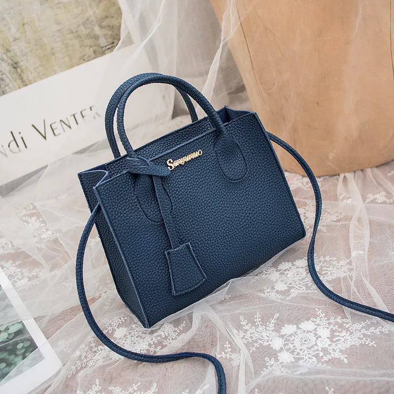 Women's messenger one-shoulder mobile phone bag in PU with zipper closure, square vertical section shape, letter print, available in multiple colours