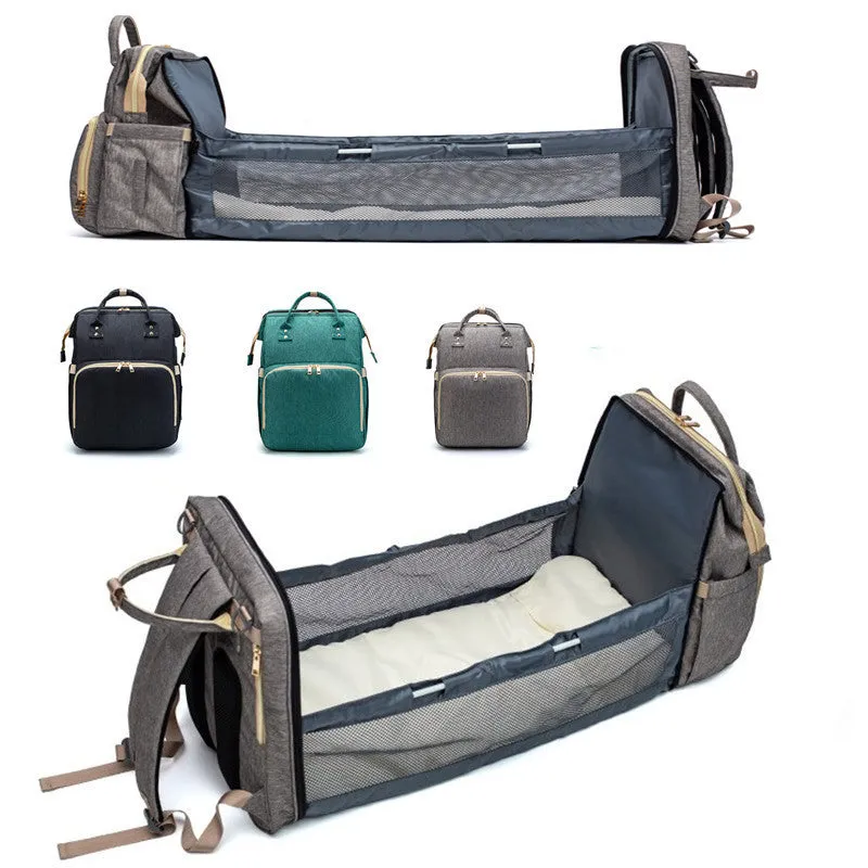 USB charging folding baby bed backpack with mattress in black, showing backpack and crib setup