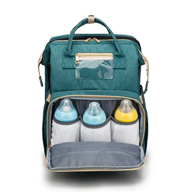 USB charging folding baby bed backpack with mattress in black, showing backpack and crib setup