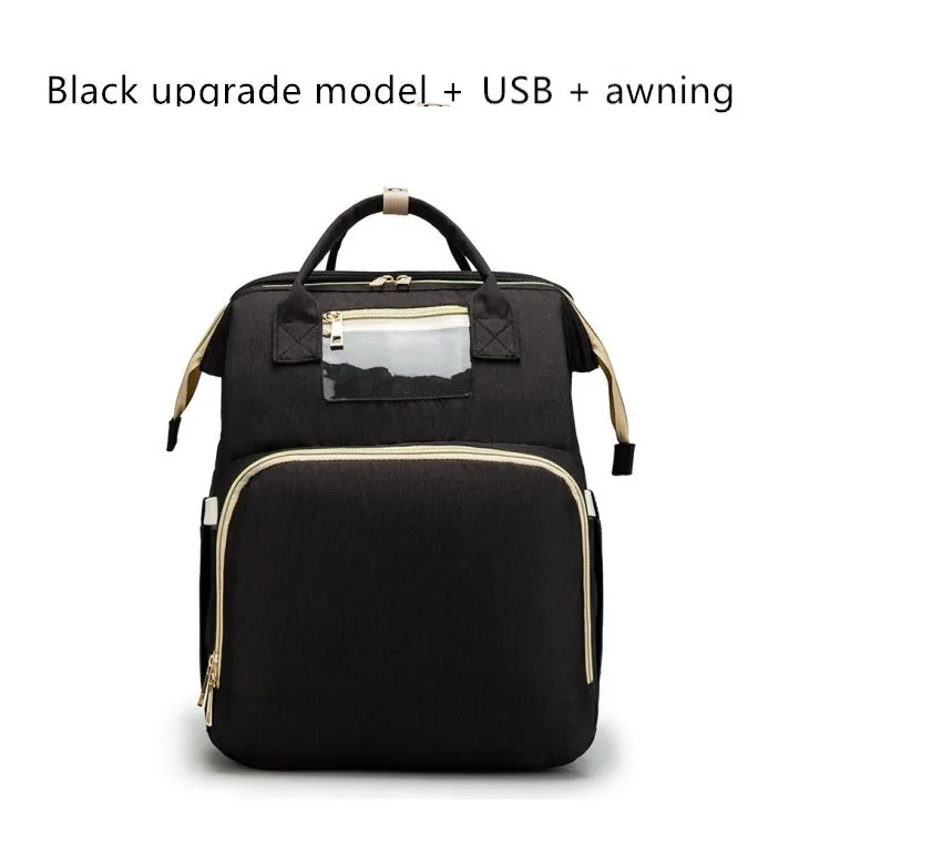 USB charging folding baby bed backpack with mattress in black, showing backpack and crib setup