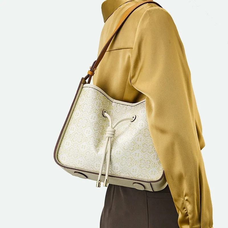 Light luxury genuine leather underarm bag in bucket shape, beige, with three-dimensional outer pocket on front