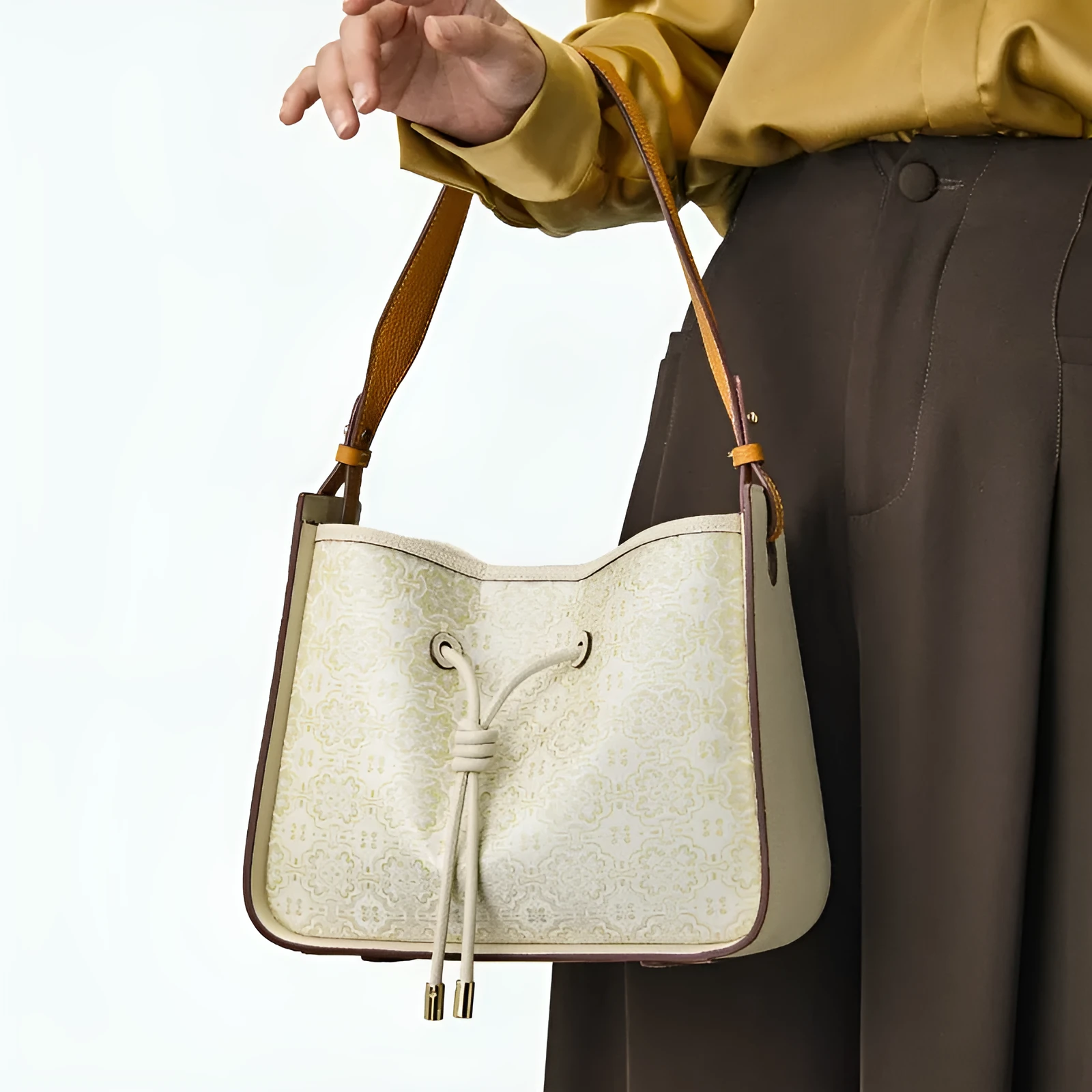 Light luxury genuine leather underarm bag in bucket shape, beige, with three-dimensional outer pocket on front
