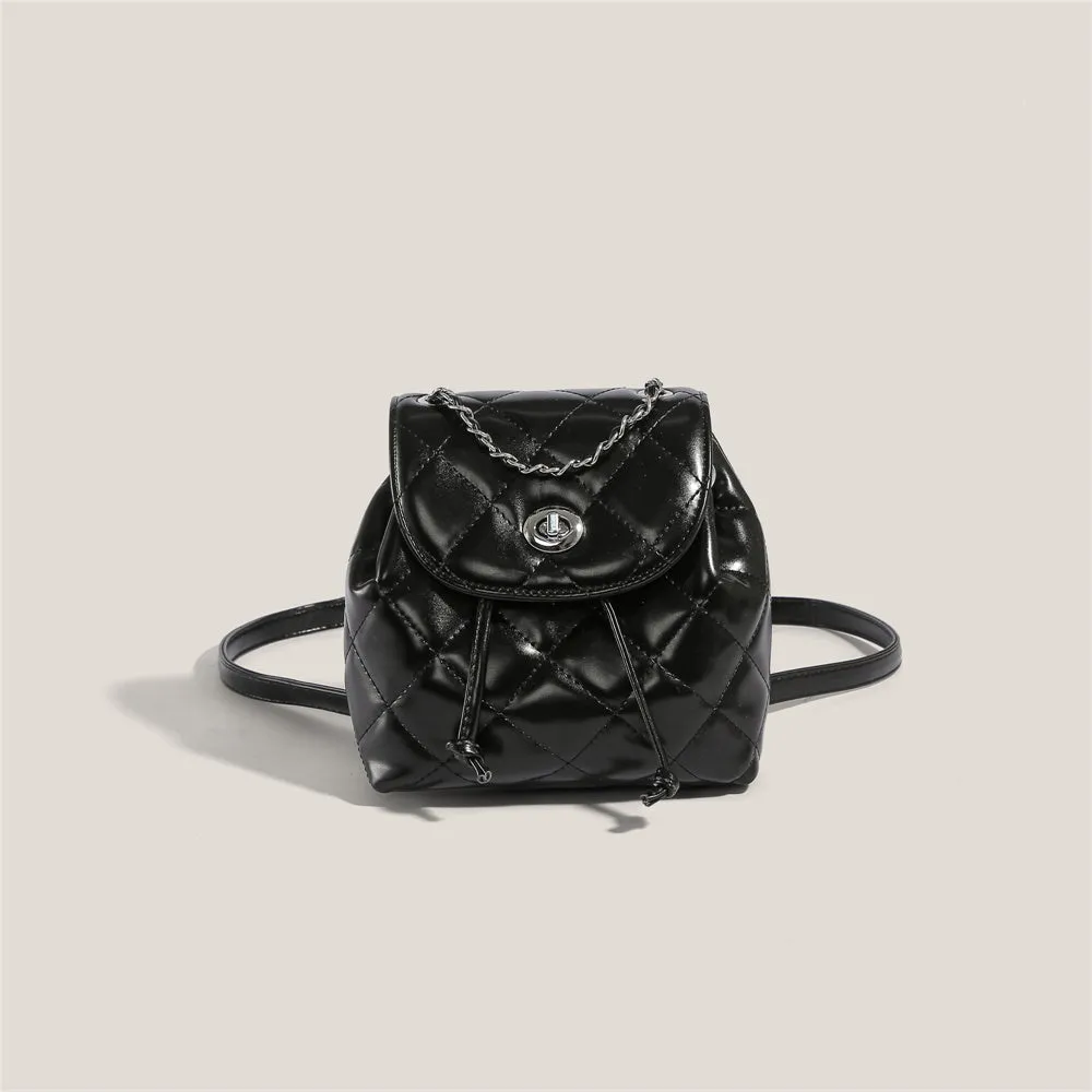 Black rhombus plaid pattern women's backpack with PU material and a cover flap.