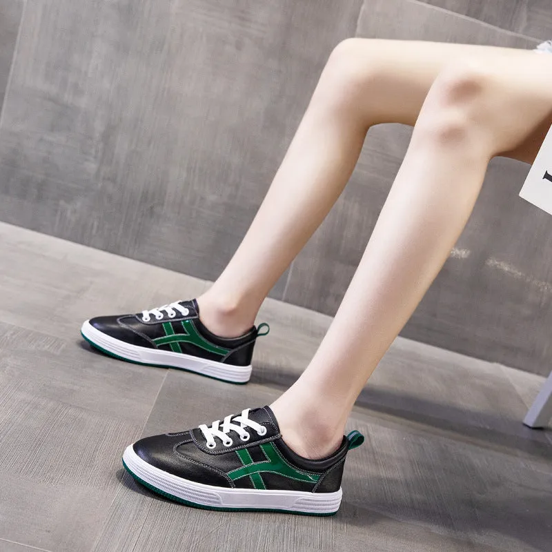 White and black low top cowhide sneakers with elastic band and round toe