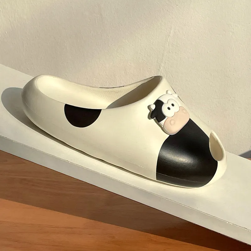 Thick-soled cartoon cow print EVA flip flops in black and white