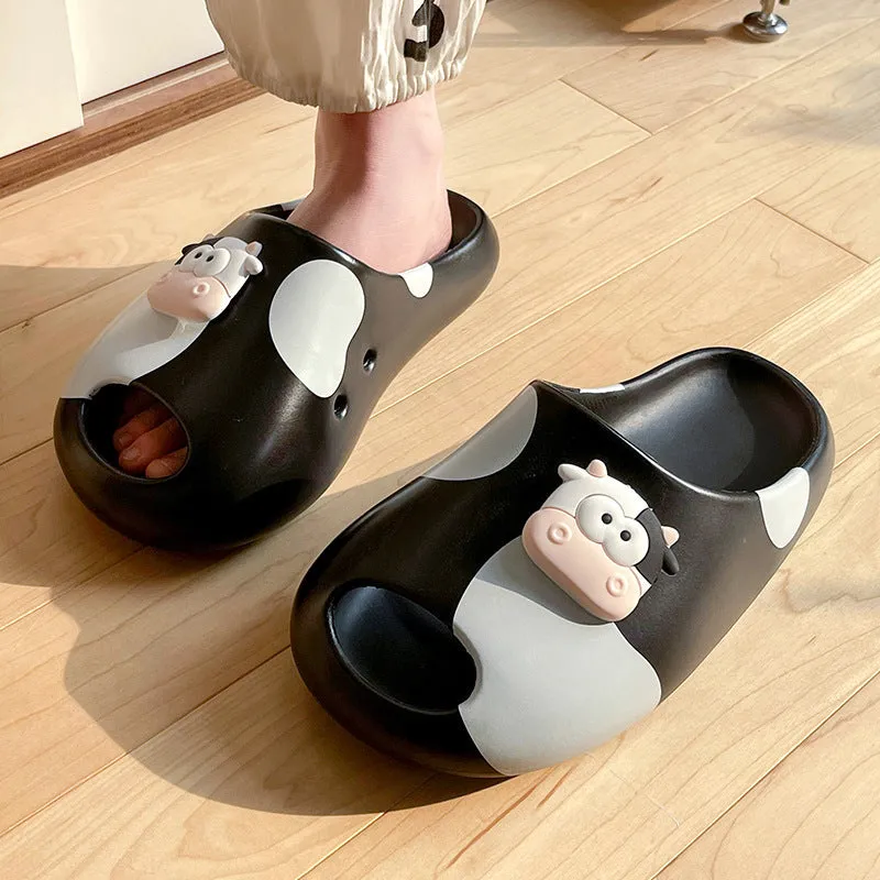 Thick-soled cartoon cow print EVA flip flops in black and white