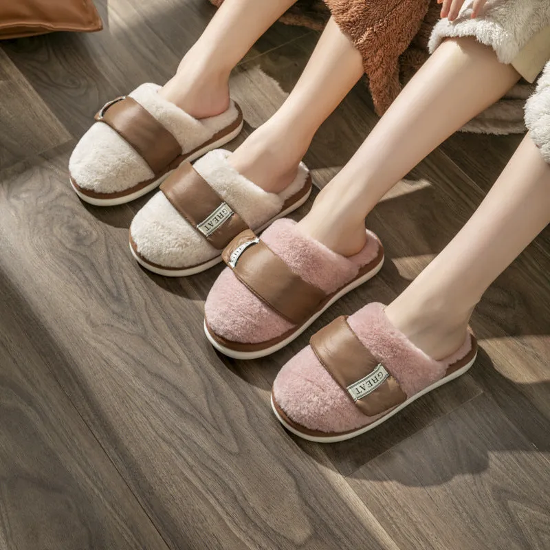 Beige plush velcro slippers with a round toe and non-slip plastic sole on a wooden floor.
