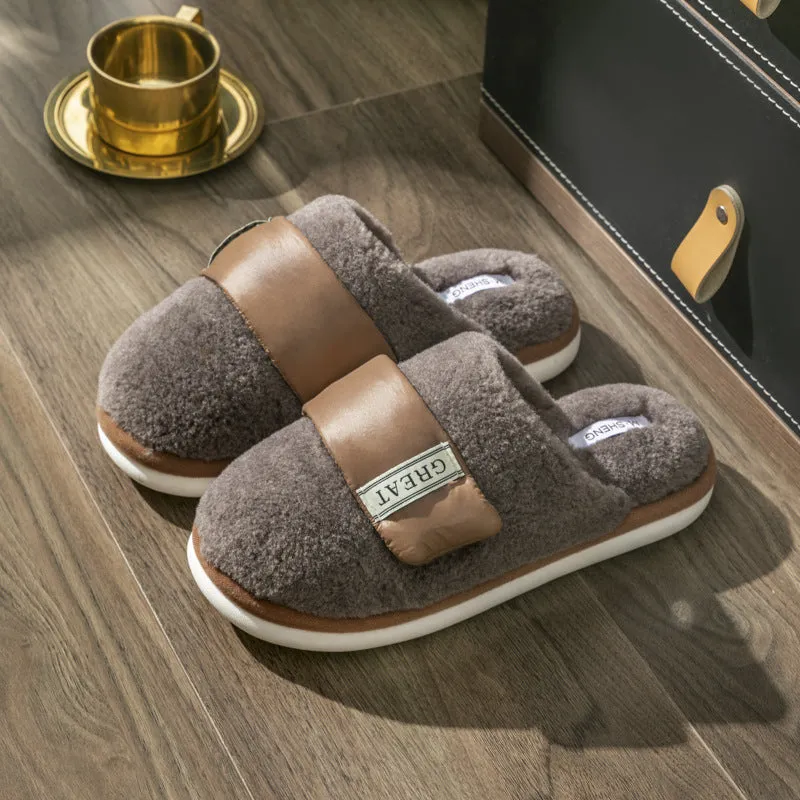 Beige plush velcro slippers with a round toe and non-slip plastic sole on a wooden floor.