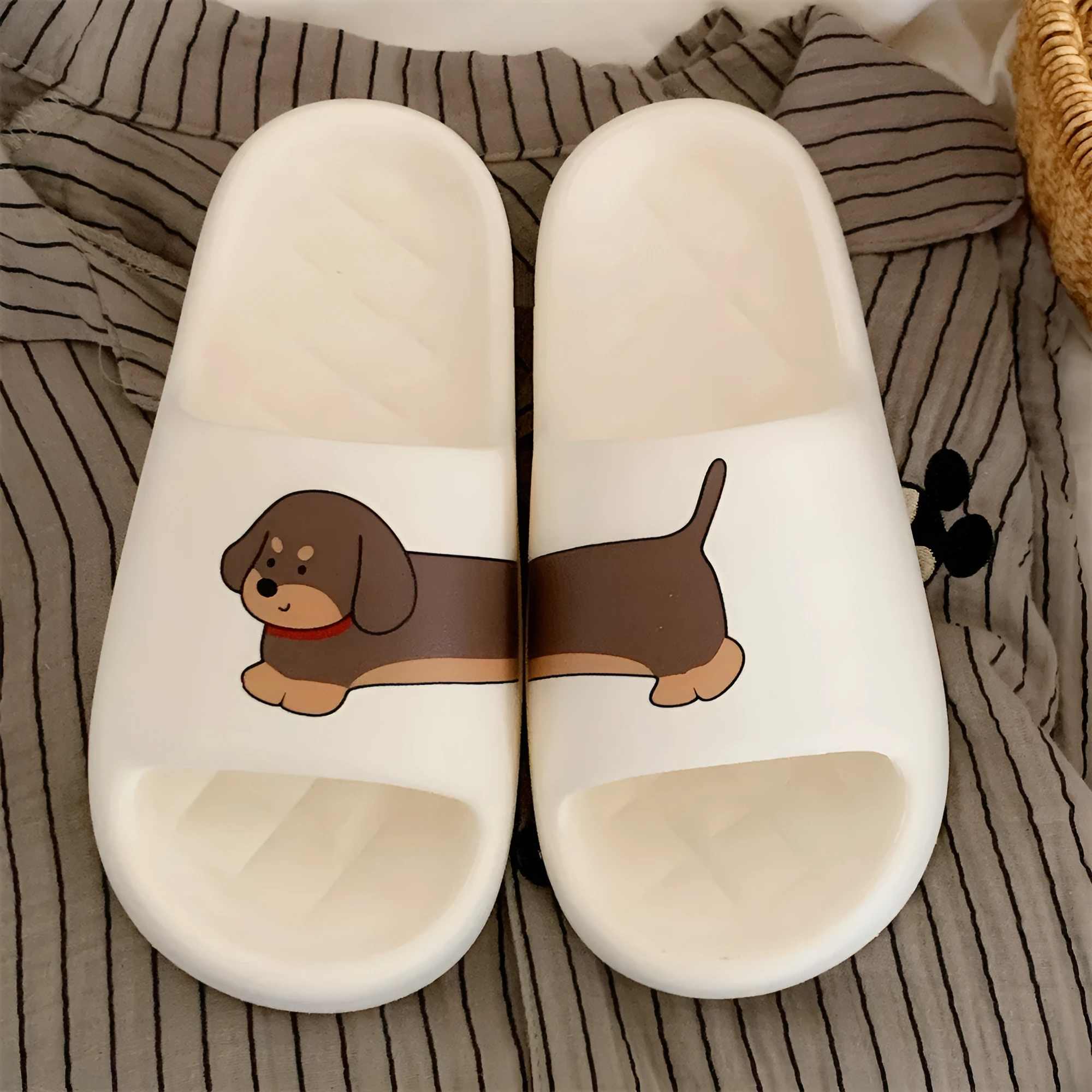EVA couple flip flop slippers with thick sole in milky white, desert brown, and black brown colours with stitching dog pattern.