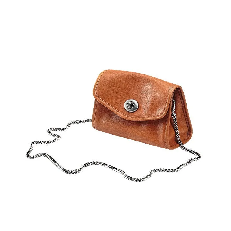 Small genuine leather messenger bag in Black with envelope flap and single shoulder strap