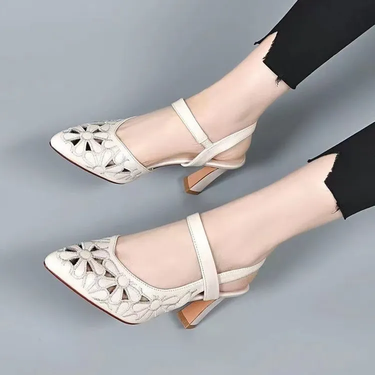 Women's pointed toe sandals with hollowed toe box in black, red, and creamy-white on a rubber sole.